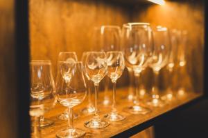 a bunch of wine glasses sitting on a table at Jacuzzi Siesławska Top Apartment in Busko-Zdrój +13 photos