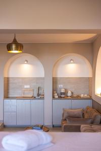 a living room with two arches and two couches at Porta di Savoca in Savoca +18 photos