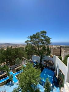 an overhead view of the pool at a resort at Rif House MEDIOUNA in Tangier