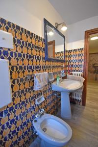 a bathroom with a toilet and a sink at MIKI APARTMENT MhD in Madonna di Campiglio