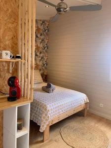 a bedroom with a bunk bed in a room at studio P ti koin trankil in La Possession