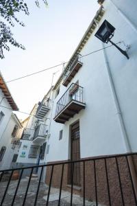 a white building with stairs on the side of it at Casa Ribera de Cazorla in Cazorla