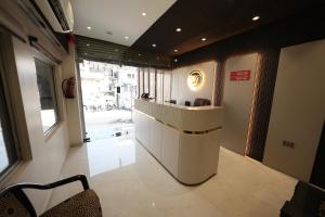 a lobby with a reception desk in a building at Hotel Ratan International in Raipur