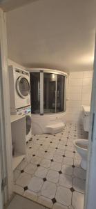 a bathroom with a toilet and a microwave at Sia Home in Vålberg +37 photos