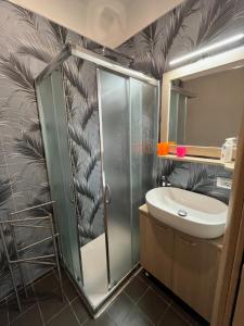 a bathroom with a shower and a sink at Genova La casa di Saretta in Marina di Ragusa +18 photos