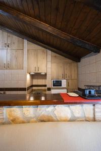 a kitchen with a counter top with a microwave at Casa Ribera de Cazorla in Cazorla +9 photos
