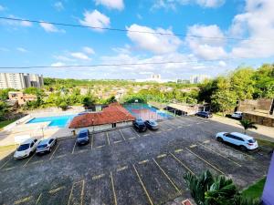 an aerial view of a parking lot with cars parked at Apartamento Park Vinhais in São Luís