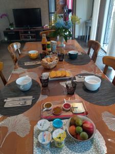a table with plates of food on top of it at LA PETITE MEUNIERE in Tramain
