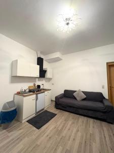 a living room with a bed and a kitchen at Apartment 2 in Golling an der Erlauf in Petzenkirchen