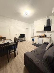 a living room with a bed and a dining room at Apartment 2 in Golling an der Erlauf in Petzenkirchen
