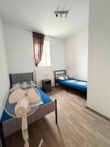 a room with a bed and a table in it at Apartment 2 in Golling an der Erlauf in Petzenkirchen