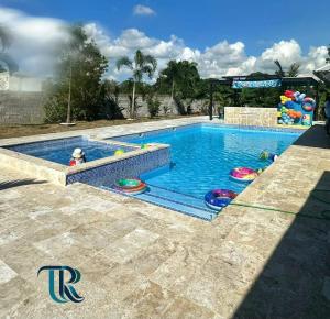 a swimming pool with toys in the water at The Resident 