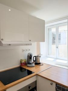 a kitchen with a counter top with a coffee maker at Excellence 2 bedrooms in Saint-Pierre-le-Vieux +18 photos