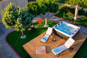 an overhead view of a swimming pool with chairs and trees at Casa Adam and spa in Zakynthos