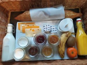 a basket filled with food and drinks and food items at Lyon Campagne in Rontalon +20 photos