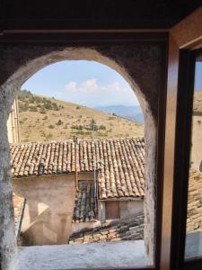 a view of a tile roof from a window at Casa vacanza da GIGI in Calascio +3 photos