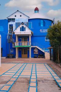 a large blue building with a building at Apartamento THEMIS Tocancipa in Bemposta