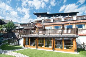 a large house with a large deck on top of it at Alla Frasca Verde in Lauco