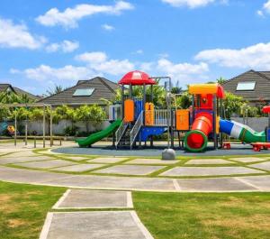 a playground with a slide in a park at Willis staycation in Sandy Bay