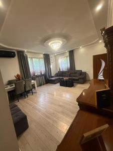 a living room with a couch and a table at home 4 room in Yerevan