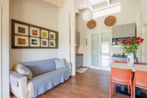 a living room with a couch and a table at B&B Kapì Country in Alghero +24 photos