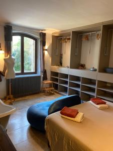 a bedroom with a bed and a large window at LA BASTIDE De La Colline in Cavaillon +146 photos