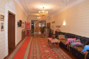 a living room with a couch and a table at Hostel East Star Khiva in Khiva