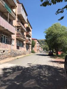 an empty street in front of a building at Jermuk in Jermuk +5 photos