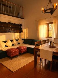 a living room with a couch and a table at Casa do Moinho da Insua in Várzea Cova