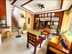 a living room with a couch and a table at Hotel Casa Teofista in Panglao Island