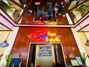a restaurant with a sign that reads good karma at Hotel Casa Teofista in Panglao Island