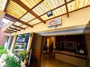 a lobby of a building with a sign on it at Hotel Casa Teofista in Panglao Island