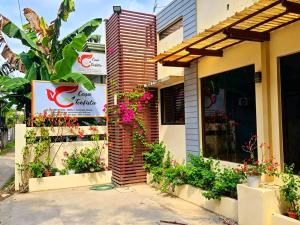 a store with flowers on the side of a building at Hotel Casa Teofista in Panglao Island