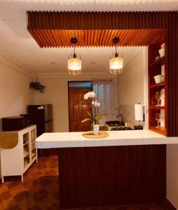 a kitchen with a large island in the middle at Sweet Home JACÓ in Herradura