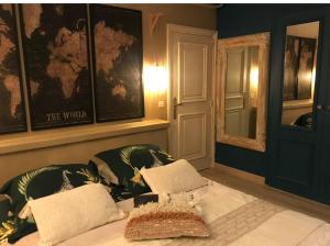 a bedroom with a bed and a map on the wall at Villa piscine jacuzzi Mas la Bregeonière in Roquefort-les-Pins