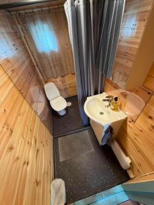 an overhead view of a bathroom with a sink and a toilet at The Perfect Stop - Viking Haven in Lødingen