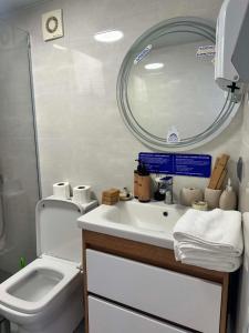 a bathroom with a sink and a mirror and a toilet at Shaori Space - შაორი სფეისი in Nikortsminda +104 photos