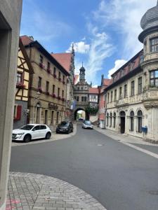a city street with cars parked on the street at Sierra Ferienwohnung in Marktbreit