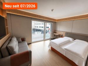 Llit o llits en una habitació de Hotel MUSE