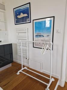 a room with a television and a white stand at Paradis sur l'Aber in Landéda +4 photos