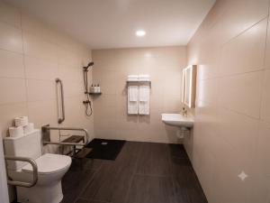 a bathroom with a toilet and a sink at Hotel A&M Mostoles-Alcorcon-M506 in Alcorcón