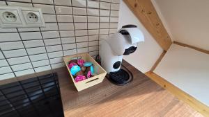a coffee maker and a box in a corner of a kitchen at PARADAJS City Center Apartments - 24h self check-in & free private parking in Spišská Nová Ves
