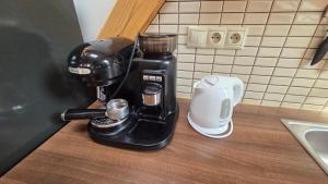 a coffee maker sitting on top of a counter at PARADAJS City Center Apartments - 24h self check-in & free private parking in Spišská Nová Ves +60 photos