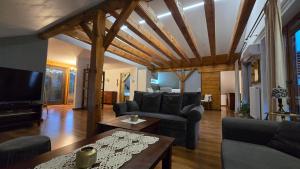 a living room with a couch and a table at Barytowy apartament in Tarnowskie Góry