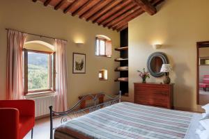 a bedroom with a bed and a window at Agriturismo Piettorri in Casole dʼElsa +91 photos