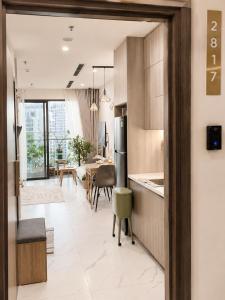 a kitchen and dining room with a table and chairs at The Opus One 1 in Long Bình