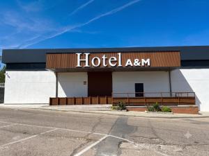 a hotel am sign on the side of a building at Hotel A&M Mostoles-Alcorcon-M506 in Alcorcón