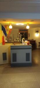 a kitchen with a counter top in a room at Class-Hôtel in Poitiers +14 photos