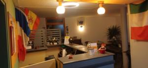a kitchen with a counter and a sink in a room at Class-Hôtel in Poitiers