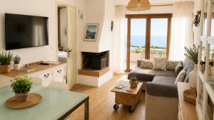 a living room with a couch and a fireplace at Apt CON VISTAS ALAS ISLAS MEDAS in Girona
